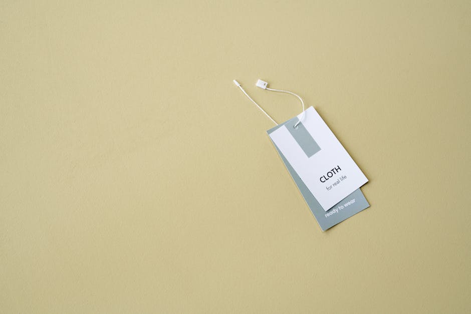 A stylish clothing label on a muted background offers ample copy space.