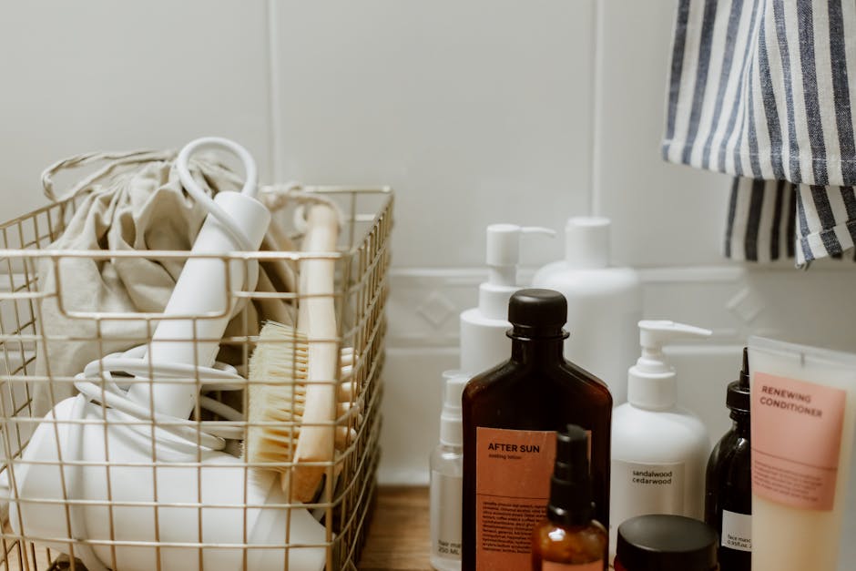 Aesthetic arrangement of bathroom products and accessories in a wire basket on a wooden shelf.
